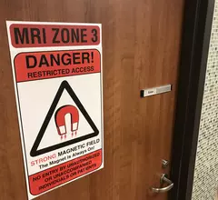 MRI safety zone warning sign at entrance into an MRI imaging room at Northwestern Central DuPage Hospital.