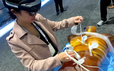 This is an augmented reality (AR) procedure training system on display at RSNA 2022 by MediView. The headset allows the user to see inside the the training phantom to practice or perform procedures on a co-registered CT scan and the patient. #RSNA22 