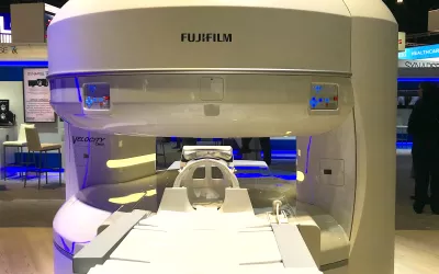The open MRI Velocity Oasis system on display at the Fujifilm booth at RSNA 2022. The 1.2T system can support patients up to 660 pounds and has a large 83 cm wide table. #RSNA #RSNA22