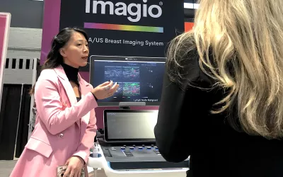 The new breast imaging modality of opto-acoustic ultrasound (OA/US) is explained at the Seno Medical booth at RSNA 2022. The technology uses 6 separate images to show the functional and anatomic features of breast tissue and immediately display features that differentiate tumor neoangiogenesis. this may prevent the need for additional testing or biopsy. The system just received U.S. FDA PMA clearance and the vendor celebrated with champaign being served in their booth. #RSNA22 #RSNA