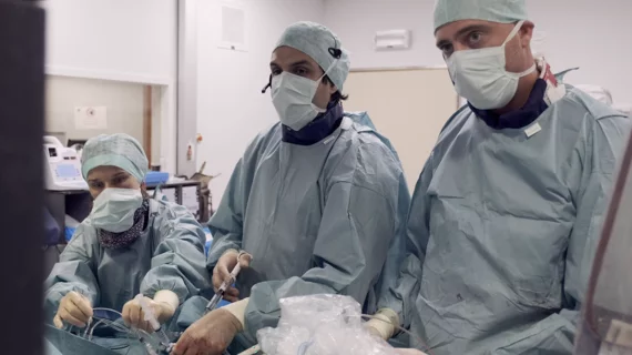 Carlos Collet, MD, PhD, (center) and colleagues perform CT-guided PCI. Image courtesy of CoreAalst. 