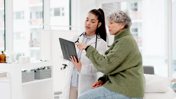 old woman or doctor shaking hands with patient