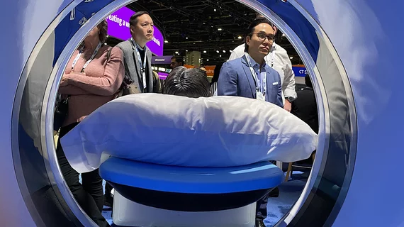 RSNA attendees through bore of the new release Philips CT 5300 scanner at RSNA 2024. Three new CT systems were released at RSNA that included numerous AI enhancements. Photo by Dave Fornell. #RSNA #RSNA24 #RSNA2024 