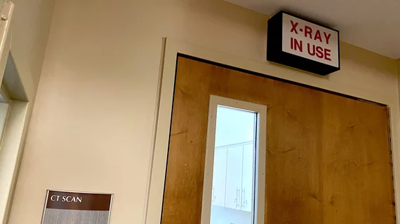 Ct scanning room with X-ray radiation warning sign above the door at Wellstar Kennestone Hospital. Photo by Dave Fornell